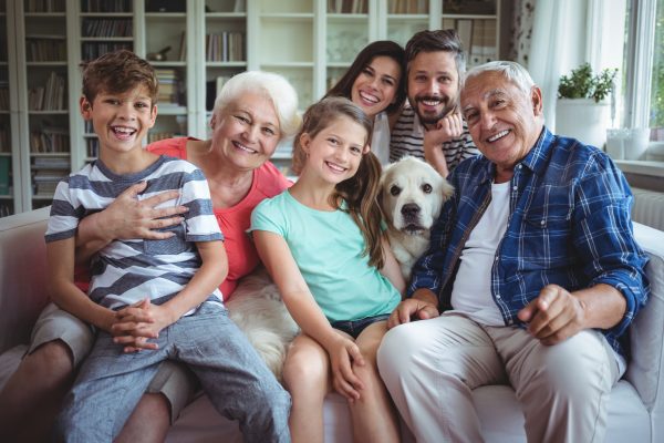 Happy family smiling after a visit to their trusted family dentist in Ottawa